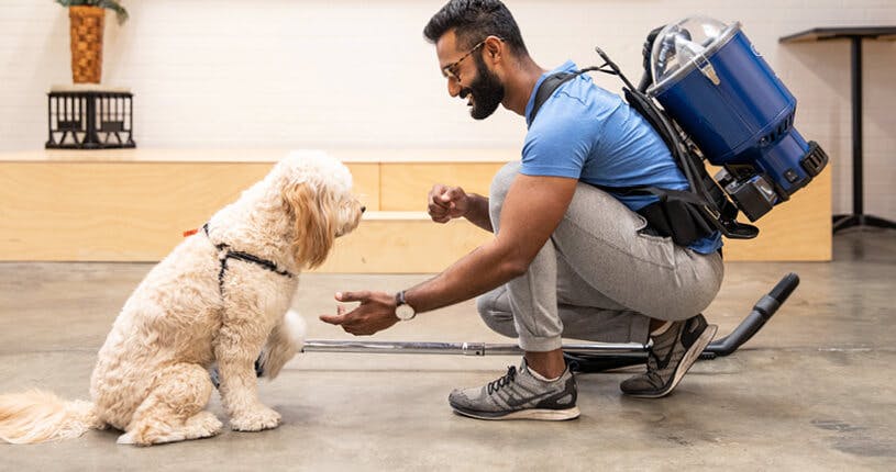 man petting dog